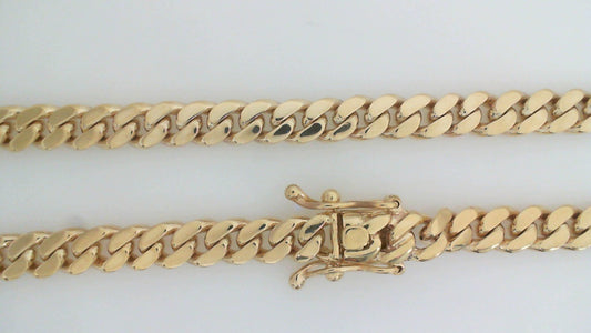 10K Yellow Gold Triple Clasp Cuban Link Chain 7Mm 24In 68.2Dwt